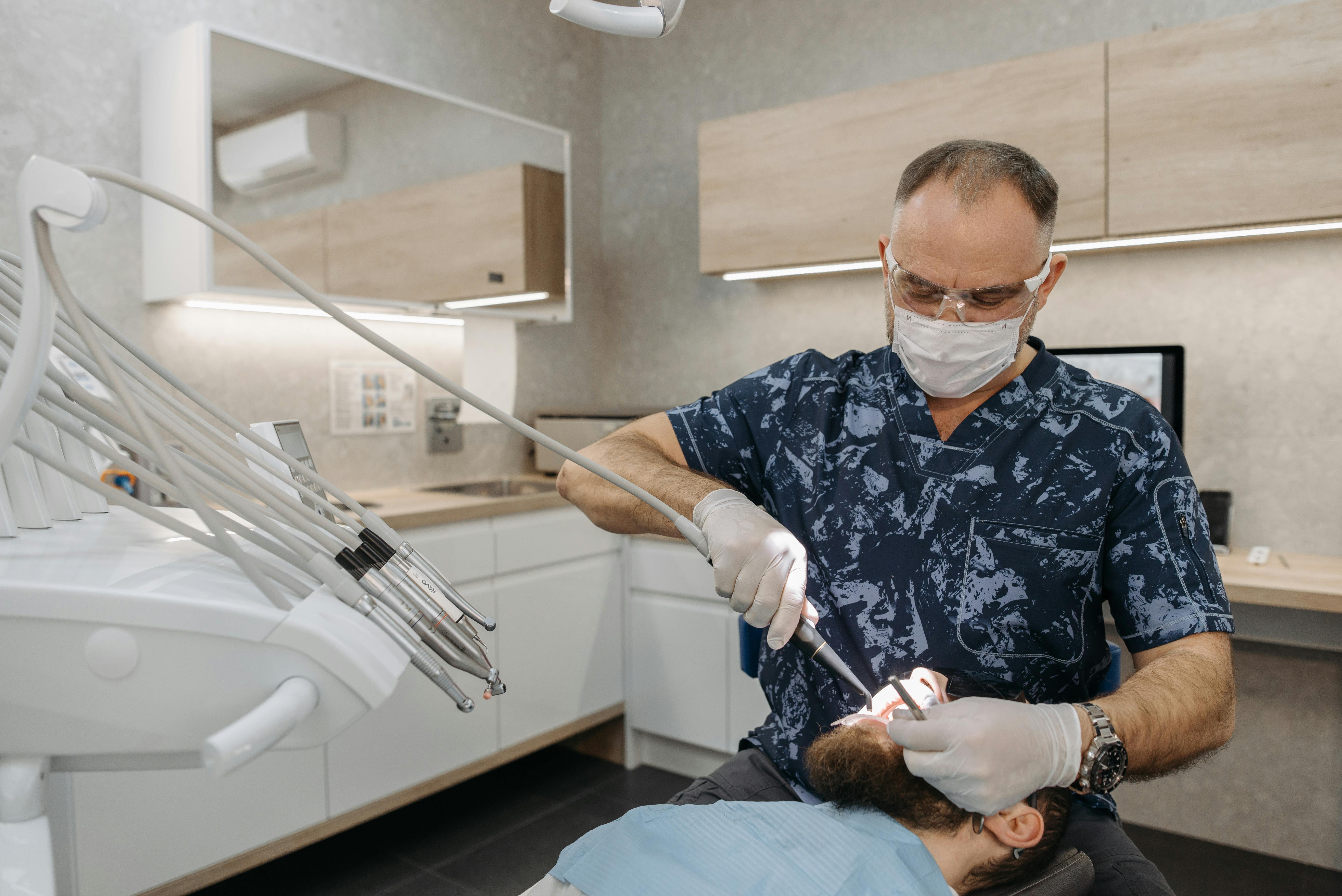 Professional dentist with patient